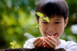 child-with-plant-300x200-1