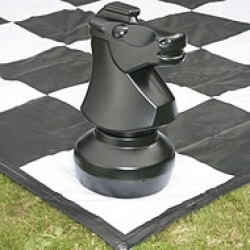 Giant chess knight piece on board.