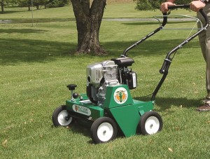 Power rake lawn care machine