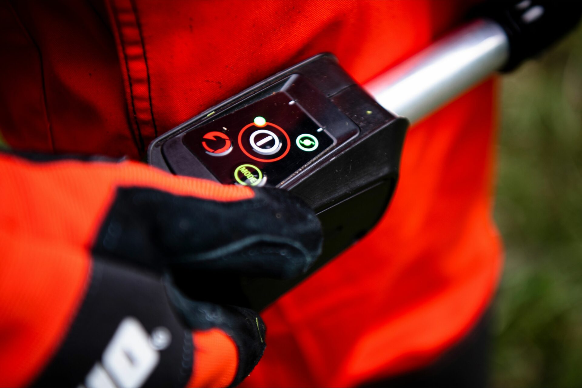 ikfjxklt5wb.jpg - Mowers Online Person holding digital meter with display screen
