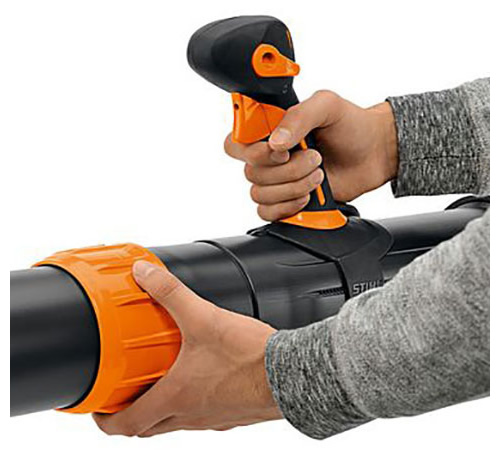 tkduqfolzq3.jpg - Mowers Online Person holding black and orange gaming controller