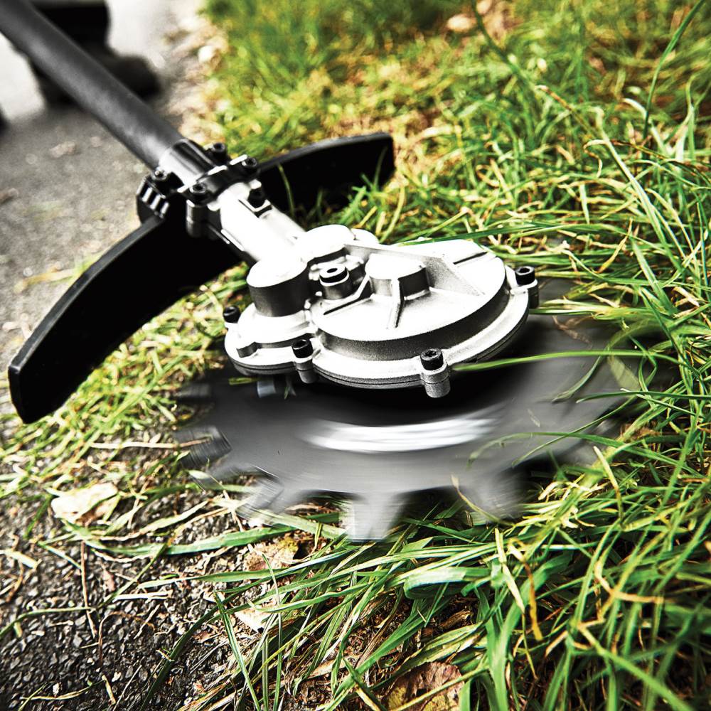 uhkilylbflk.jpg - Mowers Online String trimmer head with black shaft and white spool